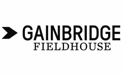 Text logo with a left-pointing arrow and the words "Gainbridge Fieldhouse.