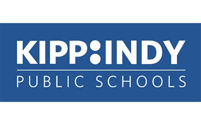 The image shows the logo for KIPP Indy Public Schools, featuring white text and a colon symbol on a blue background.